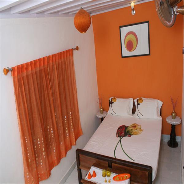Orange room at The Jade in Coorg